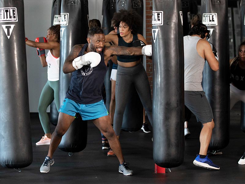 group doing boxing rounds class