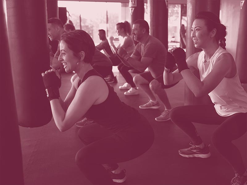 group completing boxing class warm-up